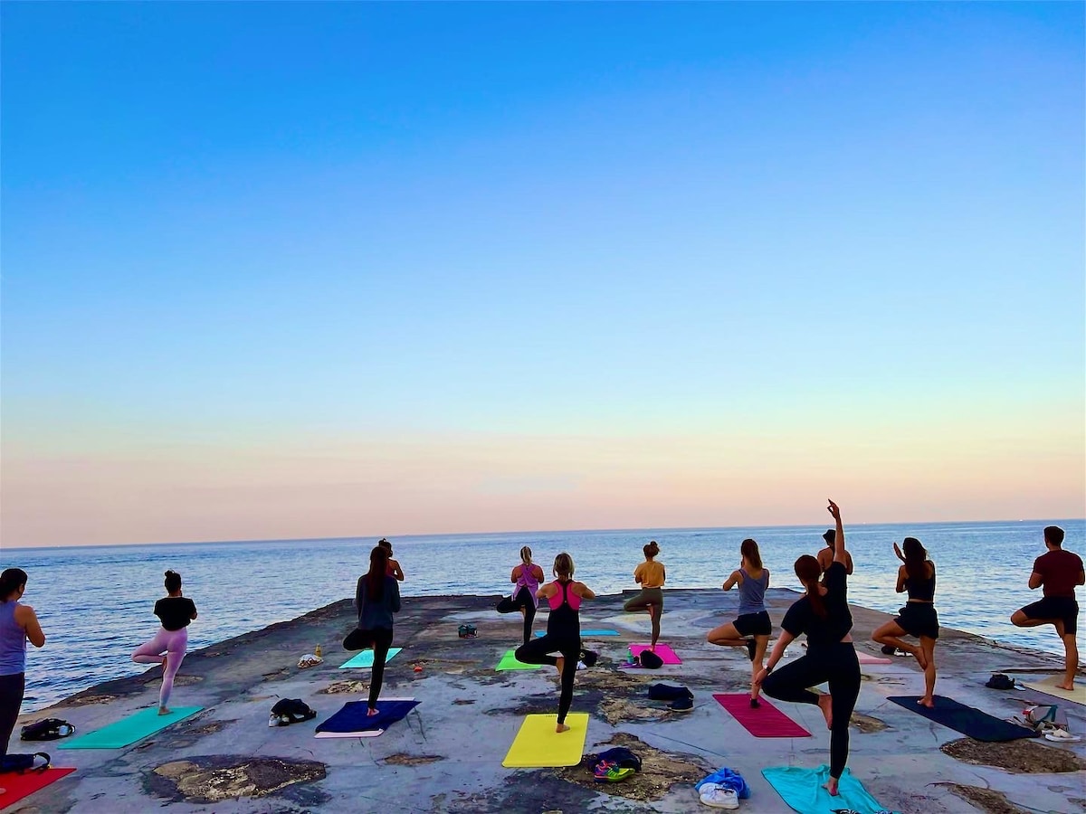 Practice yoga by the Maltese Sea